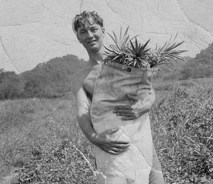 Joe holding pineapples